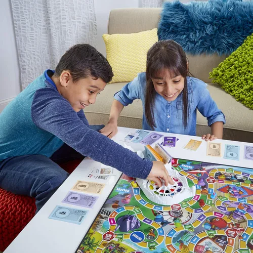 Vista 16 de Juego de mesa The Game of Life, juegos familiares para niños de 8 años en adelante, las clavijas vienen en 6 colores, juegos de mesa familiares