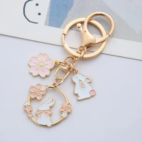 Vista 2 de Fuqimanman2020 Lindo llavero de conejo Sakura Kawaii Flower Rabbit Zanahoria Melocotón hongo llavero para mujeres Regalo de Pascua