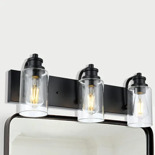 Vista 2 de Lámpara de baño vintage de 3 cabezales en acabado negro mate, pantalla de vidrio transparente clásica, iluminación de baño sobre espejo, lámpara