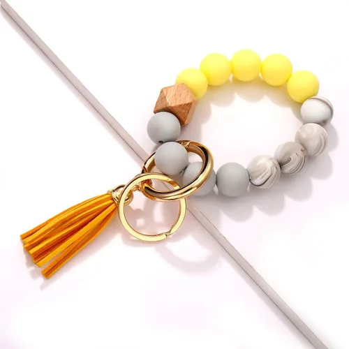 Vista 6 de boderier Pulsera de silicona llavero pulsera pulsera llavero portátil casa coche llaves anillo titular con borla