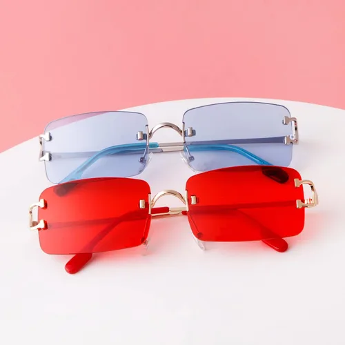 Vista 7 de Laurinny Gafas de sol rectangulares retro para mujeres y hombres, gafas sin montura de los años 90, lentes teñidas de metal, color caramelo