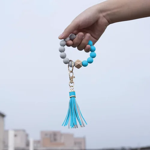 Vista 4 de Llavero de silicona para mujer con cuentas de llavero de pulsera portátil de borla de coche