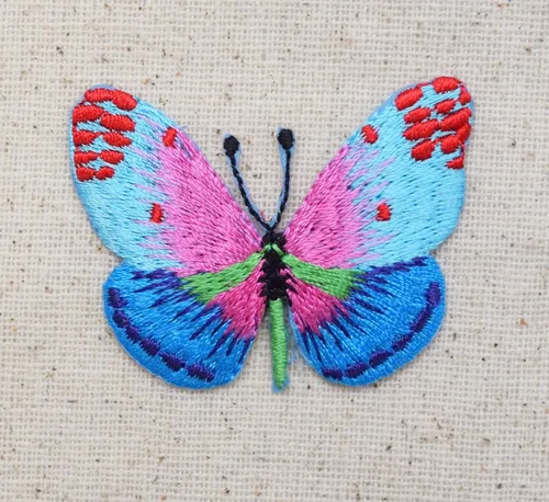 Vista 2 de Mariposa - Parche bordado para planchar en azul/rosa con puntos rojos