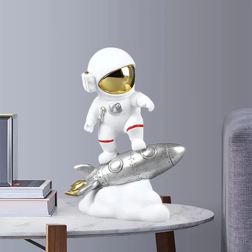 Vista 5 de Figura de astronauta de resina, escultura de astronauta, estatua del espacio exterior para decoración del hogar, adorno de oficina, cohete plateado