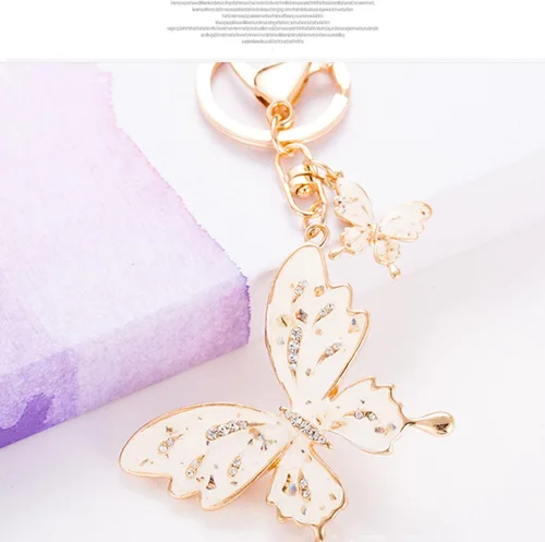 Vista 7 de Llavero de coche para hombres y mujeres, llavero de mariposa, llavero multifuncional, bonitos accesorios para mujeres, color blanco
