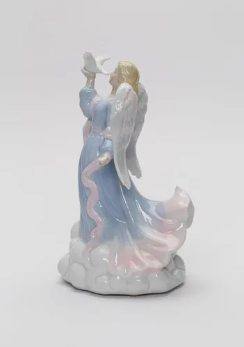 Vista 3 de Cosmos Gifts 1334 - Figura inspiradora de porcelana fina con diseño de ángel de la paz sosteniendo paloma, caja de música