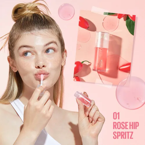 Vista 2 de Kaja Juicy Glass - Aceite para rellenar los labios 01 Rose Hip Spritz Hidratante, se siente voluminoso y ligero con aceite de frutas de árbol