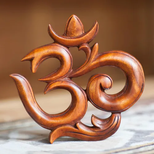 Vista 2 de NOVICA Escultura de pared tallada a mano en madera de Suar 'Sacred Om