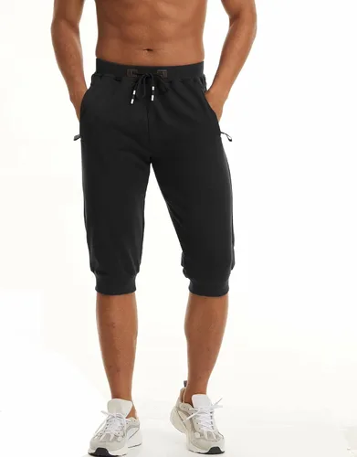 Vista 2 de MAGCOMSEN Pantalones capri deportivos 34 para hombre con bolsillos con cremallera, longitud a la rodilla, pantalones cortos de entrenamiento