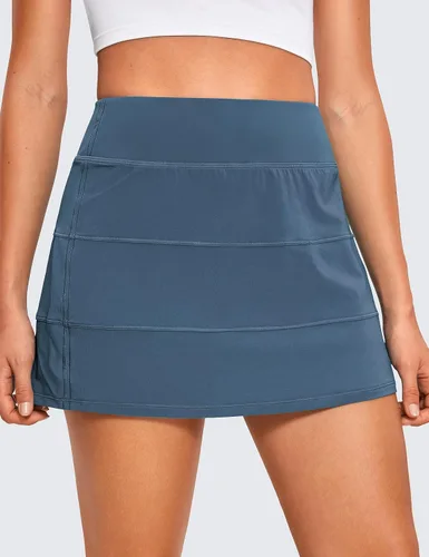 Vista 2 de CRZ YOGA Faldas de tenis de cintura alta para mujer con 3 bolsillos, faldas de golf, acampanadas, ligeras, bonitas, atléticas, casuales