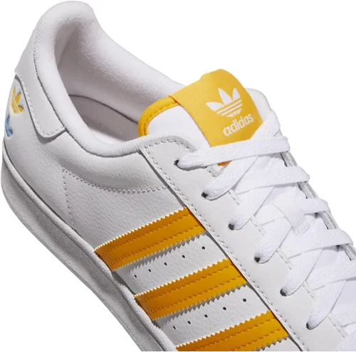 Vista 4 de adidas Originals Men's Superstar Sneaker, WhiteTeam Collegiate GoldPulse Blue