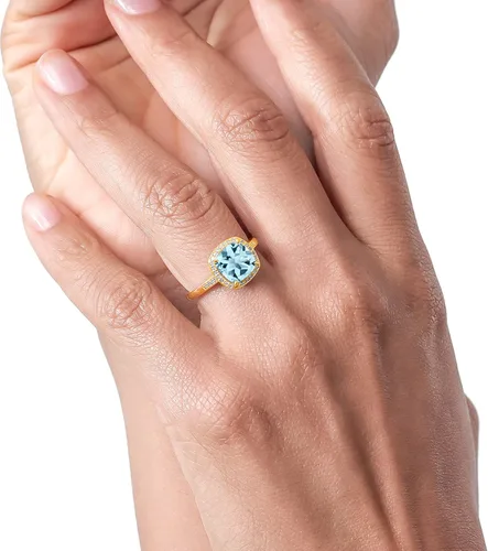 Vista 4 de Gem Stone King Anillo de compromiso de oro amarillo de 10 quilates con topacio azul cielo y diamante para mujer