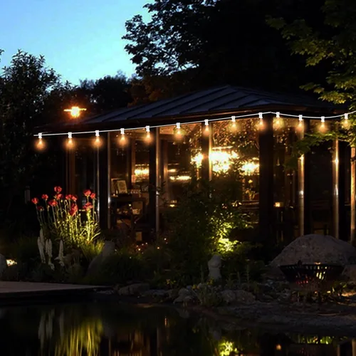 Vista 6 de Tira de luces Edison ST35 de 25 pies para patio al aire libre con 27 bombillas transparentes, 5 vatios/120 voltaje/base E12, cable blanco
