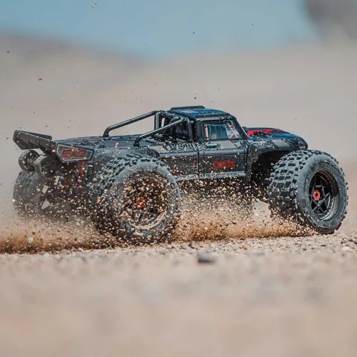 Vista 8 de ARRMA Camión RC Outcast 4X4 8S BLX 1/5 Camión de Acrobacias Negro RTR (Transmisor y Receptor Incluidos, Batería y Cargador No Incluidos) ARA5810V2T1