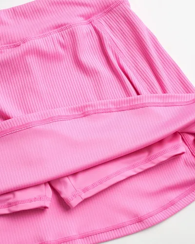 Vista 3 de New Balance Conjunto de falda para niña, 2 piezas, camiseta de manga corta y falda pantalón (talla 7-16)