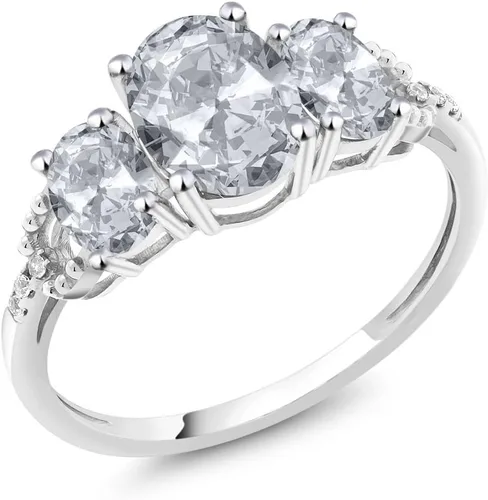Vista 7 de Anillo de compromiso ovalado de oro blanco de 10 quilates con piedra natal y topacio blanco de 3 piedras con detalles de diamante Centro de 0.315