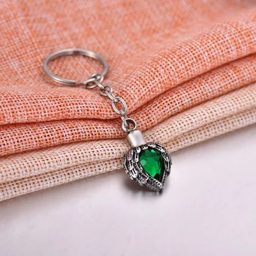 Vista 4 de Llavero de cremación de acero inoxidable con alas de ángel para cumpleaños, piedra de la suerte, cenizas colgantes, joyería conmemorativa