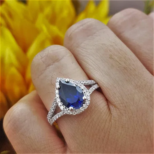 Vista 39 de Dazzlingrock Collection Anillo de compromiso con forma de lágrima y diamante blanco natural redondo de 0.45 quilates con halo de diamantes blancos
