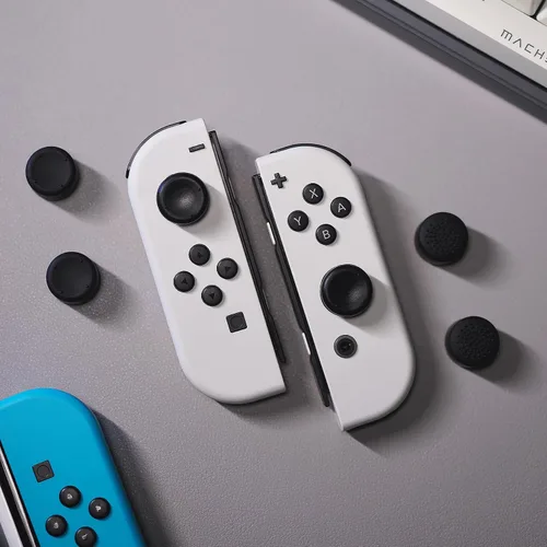 Vista 4 de eXtremeRate 4 pares de fundas negras de silicona antideslizante de longitud extendida para Nintendo Switch y Switch OLED Joy-con Controller, tapas