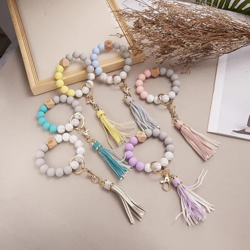Vista 7 de Llavero de silicona para mujer con cuentas de llavero de pulsera portátil de borla de coche