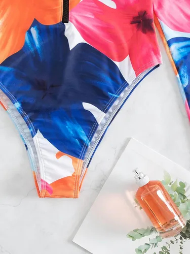 Vista 4 de WDIRARA Traje de baño de una pieza de manga larga para mujer, con estampado geométrico, cremallera frontal, control de abdomen