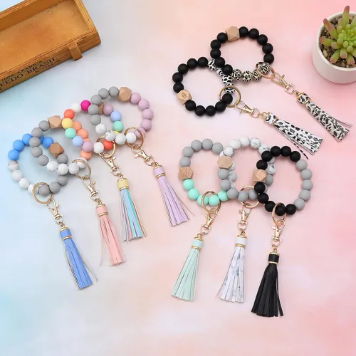 Vista 7 de BAOSIWA Pulsera de cuentas de silicona con llavero de pulsera para mujer con borla de cuero