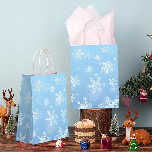Vista 5 de Jectivs Paquete de 24 bolsas de regalo para fiestas, bolsas grandes y gruesas de papel kraft blanco con copos de nieve azul hielo con tejido blanco