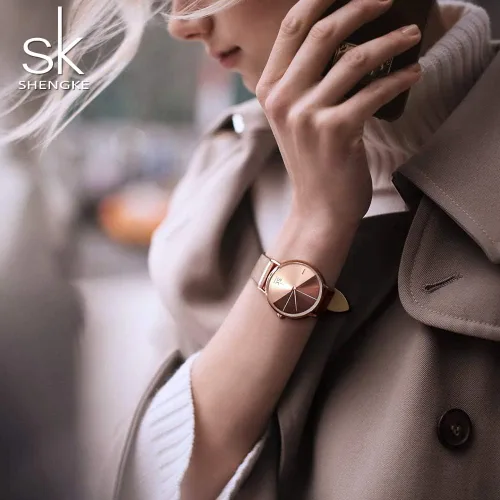 Vista 6 de SHENGKE Simplicity Creative - Reloj de pulsera para mujer, de cuero auténtico, elegante, para mujer, Movimiento de cuarzo