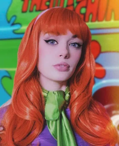 Vista 2 de Peluca naranja con flequillo, peluca larga ondulada para mujer, disfraz de cosplay, Halloween, con diadema morada y bufanda verde