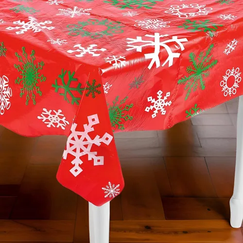 Vista 3 de Fun Express Rollo de mantel estampado de copo de nieve rojo para Navidad (100 pies de largo y desechable) suministros de fiesta