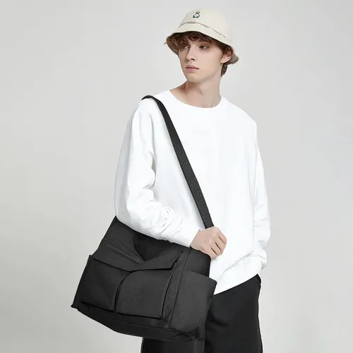 Vista 8 de KALIDI - Bolsa de lona con bolsillos, bolso bandolera grande para mujeres, hombres, universidad, trabajo, viajes, casual