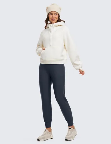 Vista 3 de CRZ YOGA Pantalones deportivos de entrenamiento con forro polar para mujer con bolsillos de 27.5 pulgadas, pantalones de senderismo y correr al aire