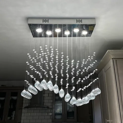 Vista 3 de Araña moderna de onda, araña rectangular de cristal con gotas de lluvia, montaje empotrado, lámpara colgante de techo cromada, ideal para comedor