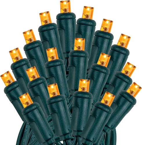 Vista 4 de Novelty Lights - Cadena de 11 pies con 50 luces LED ámbar para Navidad, para interior/exterior, espaciado de 2.5", luces de cadena de alambre verde