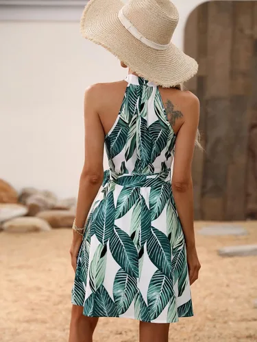 Vista 2 de WDIRARA Vestido acampanado acampanado con cuello halter y estampado tropical bohemio para mujer