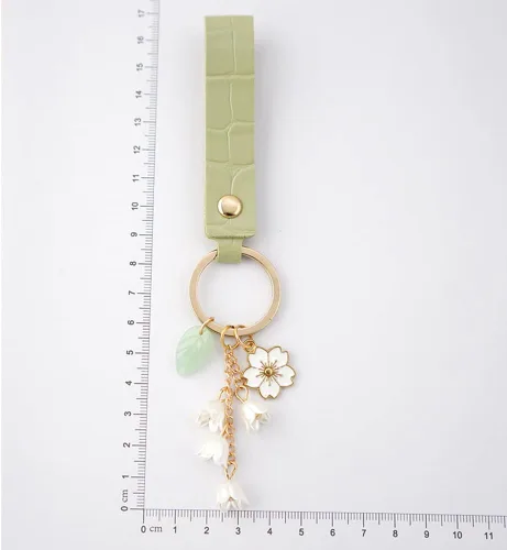 Vista 6 de SWJEWEL 4 llaveros de flores lindo bolso llavero personalizado llavero dorado para mujeres niñas coche regalo creativo