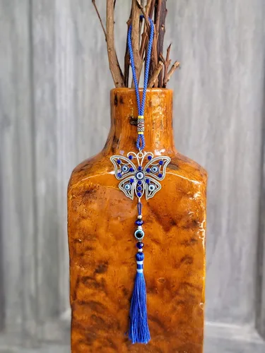 Vista 5 de LUCKBOOSTIUM Dijes de mariposa con diseño de ojo turco central en piedra de cristal azul con borlas para buena suerte, protección y bienestar