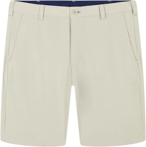 Vista 4 de IZOD - Pantalones cortos de golf Swingflex de 9.5" para hombre, elásticos, corte recto