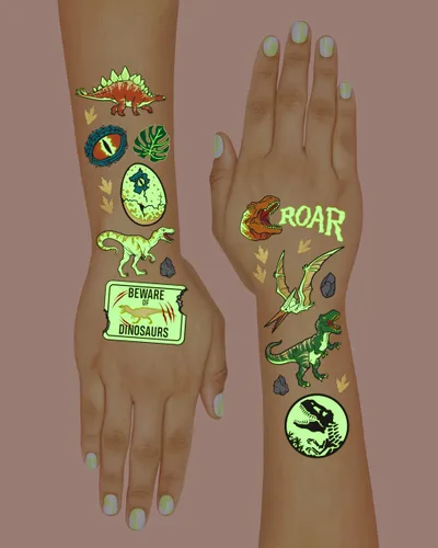 Vista 4 de xo, Fetti Tatuajes temporales de dinosaurios - 44 piezas que brillan en la oscuridad Suministros para fiesta de cumpleaños, recuerdos de fiesta