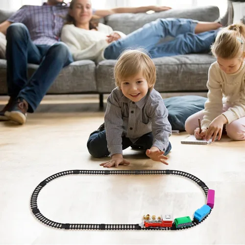 Vista 5 de Juego de tren eléctrico navideño para pista de ferrocarril de plástico y maleta portátil, superficie lisa segura para niños y colores brillantes que