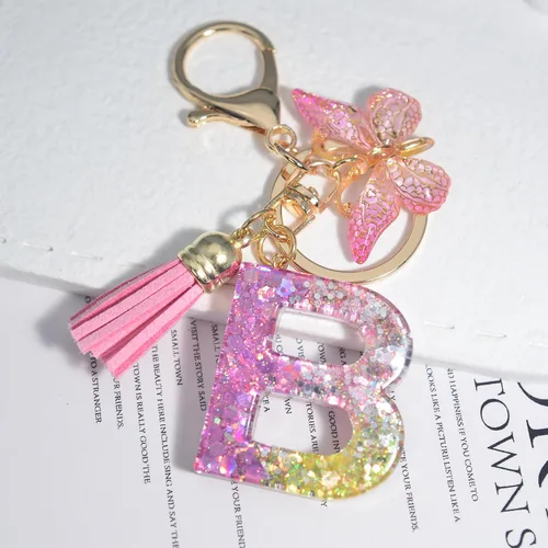 Vista 6 de Yanmucy Llaveros de letras para mujer, de la A a la Z, bonitos llaveros de mariposa con borla de cristal del alfabeto, llavero inicial para mochila