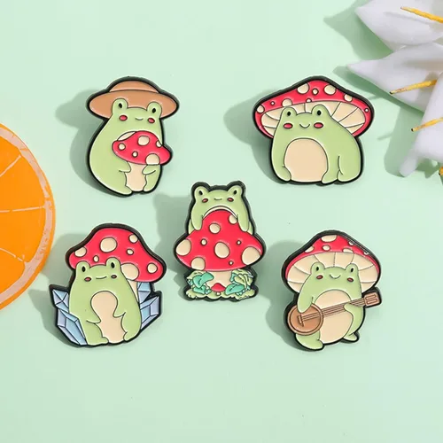 Vista 3 de Snappy - Juego de pines esmaltados de rana con diseño de animales para mujeres, hombres y niños, diseño de hongos de dibujos animados, insignias