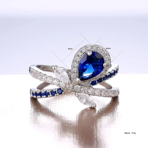 Vista 2 de Anillo de diamante completo de color rojo brillante y azul, anillo de propuesta chapado en cobre y circonio, anillo de promesa, anillos de halo