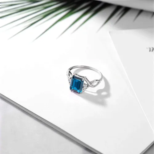 Vista 5 de Gem Stone King Anillo de compromiso de topacio azul Londres y topacio blanco de 2.75 quilates para mujer, plata de ley 925, corte esmeralda de 0.354