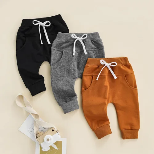 Vista 2 de Mubineo Pantalones deportivos básicos lisos para bebés, niños y niñas, cómodos pantalones de algodón con bolsillos