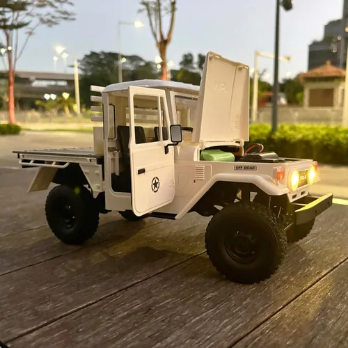 Vista 6 de HLSFWDRIVE WPL C44 RC Rock Crawler RC Camión 4x4 Off Road RTR Escala 1/16 Pastilla de orugas con control remoto todo terreno Full proporcional 370