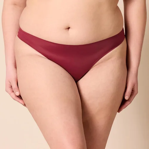 Vista 4 de Tienda Essentials Tanga elástica sin costuras para mujer, paquete de 4