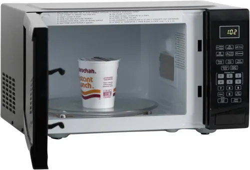 Vista 5 de Horno microondas West Bend WBMW92B de 900 vatios, compacto con 6 configuraciones pre-cocción, descongelamiento rápido, panel de control electrónico