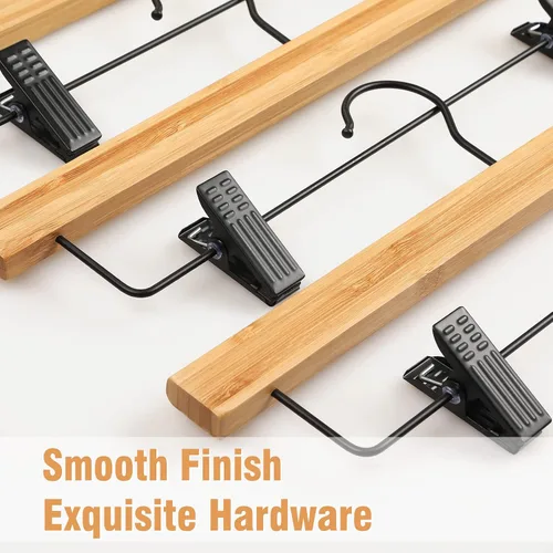 Vista 3 de TOPIA HANGER Perchas para pantalones, paquete de 10 perchas de bambú con clips negros y gancho giratorio, perchas duraderas de madera natural