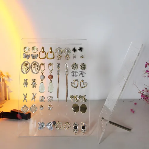 Vista 2 de LBONG Soporte para aretes, 72 agujeros, soporte de exhibición de aretes de acrílico, organizador de joyas transparente, estante de almacenamiento